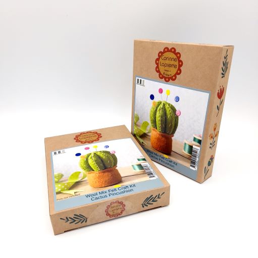 Two cardboard boxes with craft kit images on a white background