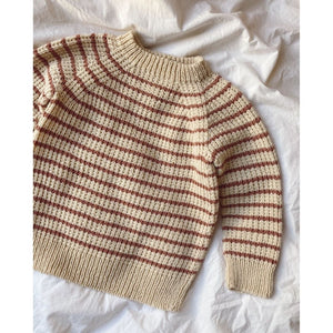 A red and white striped sweater featuring a ribbed neck, cuffs, and hem, designed with a top-down broken rib pattern.