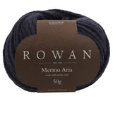 A skein of rowan merino aran yarn, showcasing its soft texture and pure velvet colour, ideal for cosy knitwear projects.