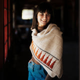 knitted poncho featured by a model