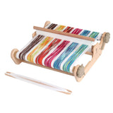  A colorful weaving machine with a wooden frame, designed for both beginners and experienced weavers to create unique textiles.