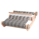 A functional weaving loom featuring a black and white design, perfect for beginners and seasoned weavers alike.