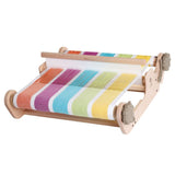  A compact, wooden-framed loom in rainbow colors, designed for both new and experienced weavers to create fun projects.