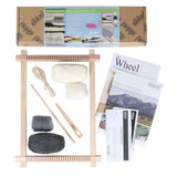 Knitting kit featuring yarn, needles, and a wooden frame, ideal for creating trendy hand-woven wall hangings.